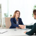 Human resources manager shaking hands with applicant