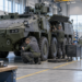 KI-generiertes Symbolbild eines Systemunterstützungszentrums für militärische Fahrzeuge.